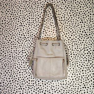 COLE HAAN Dove Grey Drawstring crossbody bag.